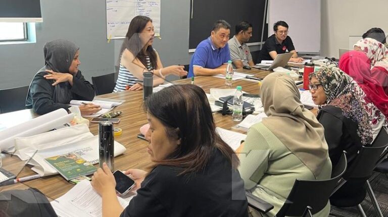 Participants review their flip charts in a Kognifi Anti-Bribery and Anti-Corruption class