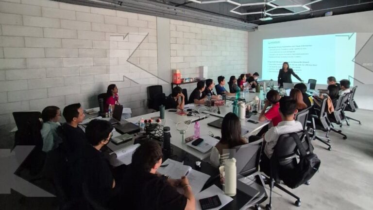 Participants work through an exercise at their tables in a Kognifi Power of Business Communication Skills class