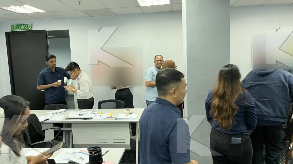 Participants build a content plan on the wall in a Kognifi Content Marketing class
