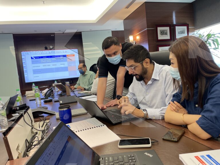 Kognifi Key Account Management class: participants review an account exercise on a laptop