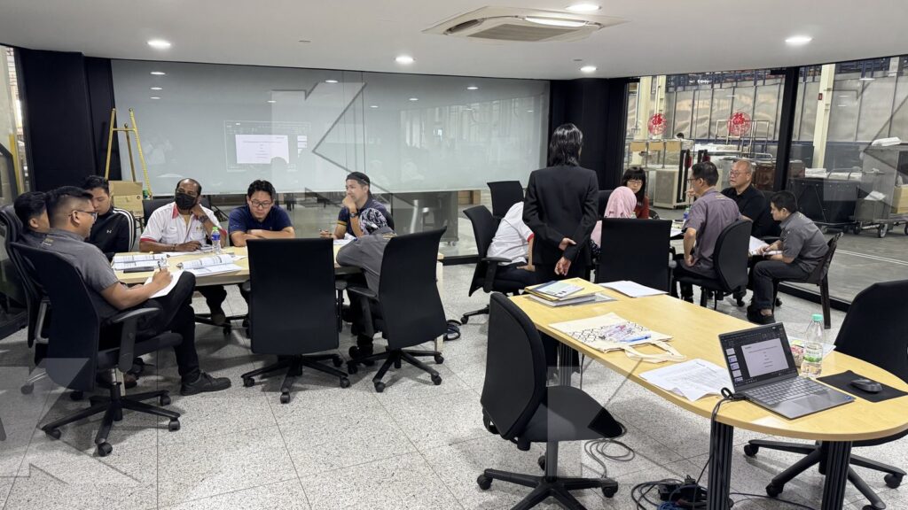 Teams work at their tables in an in-house Kognifi KPI and Metrics Management class