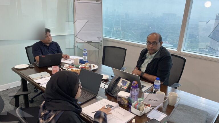 The trainer and participants at the boardroom table in a Kognifi Marketing Management class