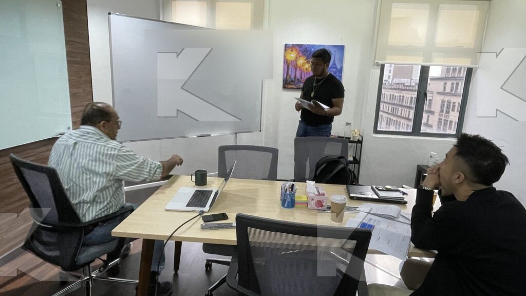 Participant presents at the whiteboard in a Kognifi Marketing Plan class