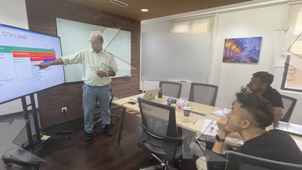 Trainer explains go-to-market steps on screen in a Kognifi Marketing Plan class