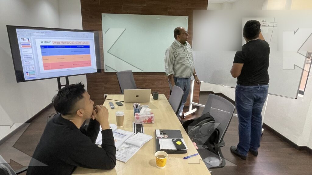 Participant writes on the whiteboard in a Kognifi Marketing Plan class